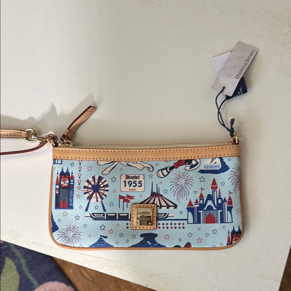 Dooney & Bourke Blue and Tan Wristlet with Theme Park Icons - Picture 1 of 3